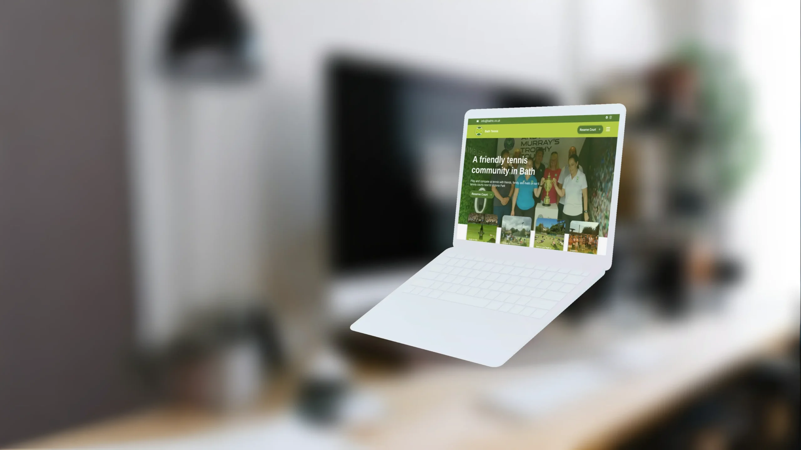 The Bath Tennis website displayed on a MacBook Air