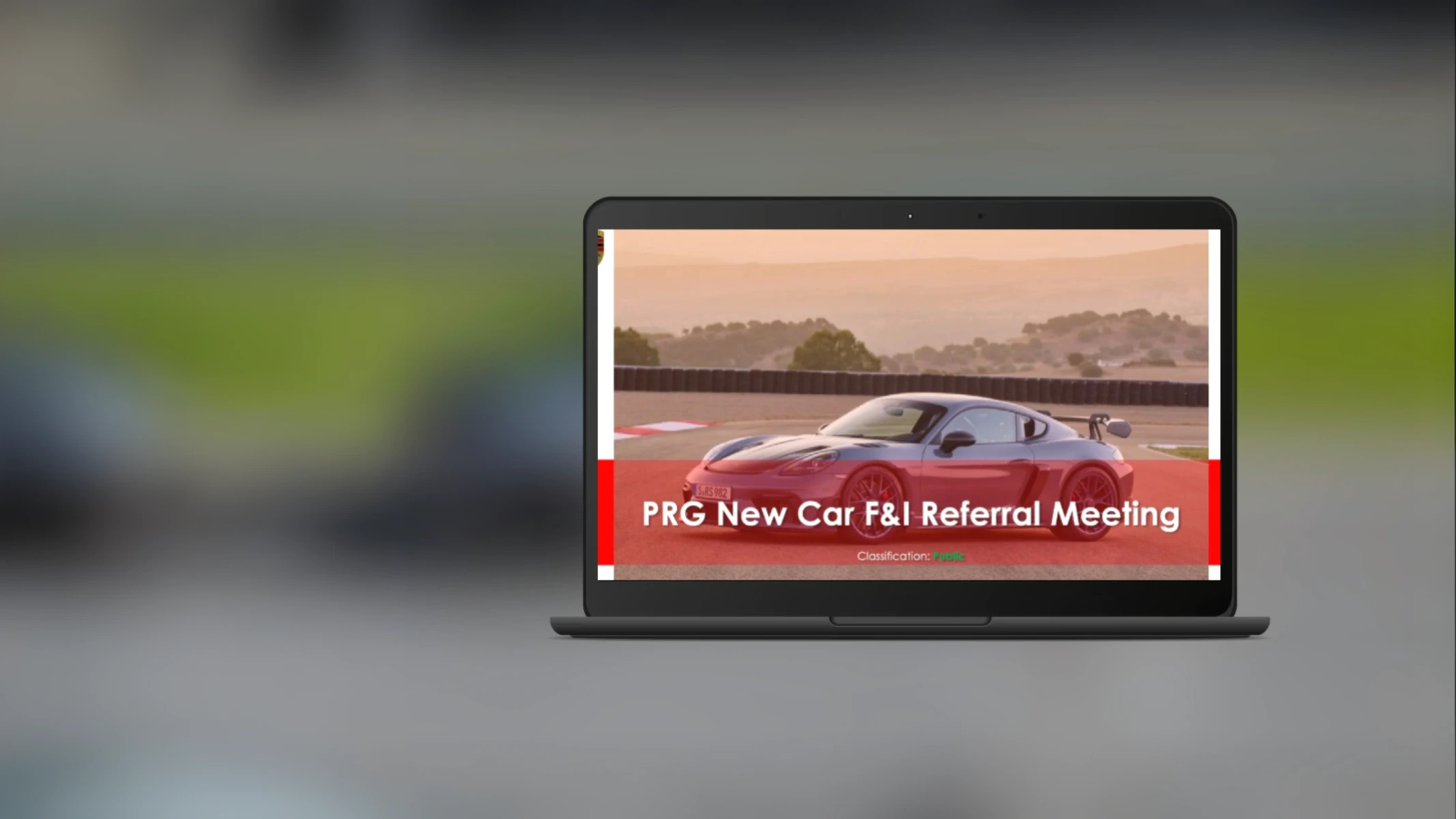 Derek Knight at Porsche Retail Group's New Car F&I Referral Meeting presentation on a laptop